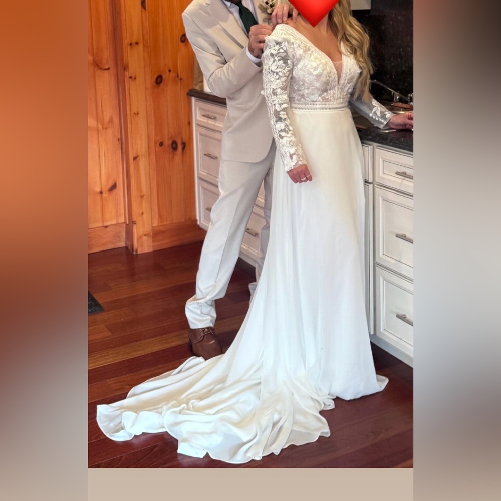 Elegant White Lace Long Sleeve Wedding Dress with Flowing Skirt